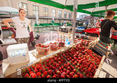 Strawberry seller at the Central Market in Riga, Latvia Stock Photo