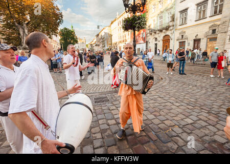 LVIV, UKRAINE - June 18: Hare Krishnas dance in Rynok (Market) Square on 18 June 2017 in Lviv, Ukraine Stock Photo