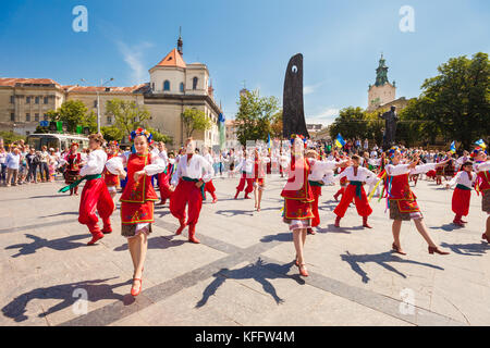 A large group of Ukranian 'Hopak' folk dancers performs at the Shevchenko Monument, Lviv, Ukraine Stock Photo