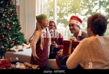 Excited Grandmother Receiving Christmas Gift From Granddaughter At Home  Stock Photo - Alamy