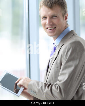portrait of senior business executive using tablet pc Stock Photo