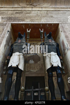 Two Anubis statues are guarding the gate. The photo is taken at