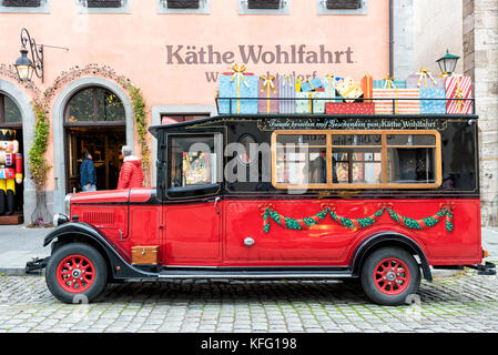 ROTHENBURG, GERMANY - OCTOBER 24, 2017: The famous Christmas store with its museum is open all year long and attracts tourists with a red oldtimer bus Stock Photo