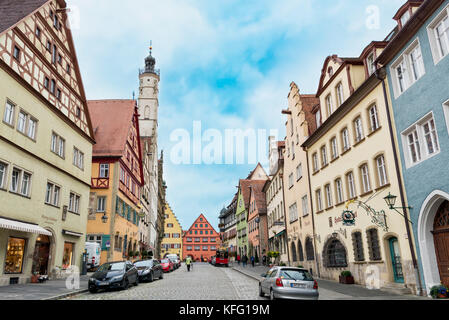 ROTHENBURG, GERMANY - OCTOBER 24, 2017: Unidentified pedestriants walk along the historic main road with its historic buildings Stock Photo