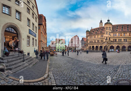 ROTHENBURG, GERMANY - OCTOBER 24, 2017: Unidentified tourists enjoy a sightseeing tour across the historic marketplace Stock Photo