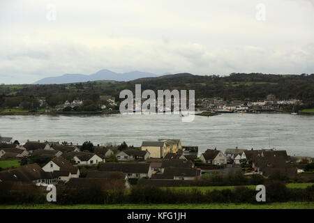 Strangford as seen from Windy Hill in Portaferry is framed with the Mountains of Mourne or Mourne Mountains, County Down, Northern Ireland. Strangford (from Old Norse Strangr-fjǫrðr, meaning 'strong fjord') is a small village at the mouth of Strangford Lough in County Down, Northern Ireland. It has a population of 475 according to the 2001 Census. On the other side of the lough is Portaferry. Transport NI, an executive agency of the Department for Infrastructure, operates the Portaferry - Strangford Ferry service across Strangford Lough between the villages of Strangford and Portaferry. Stock Photo