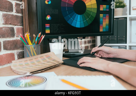 professional beauty woman editor using digital pad pen drawing design and retouching. Stock Photo