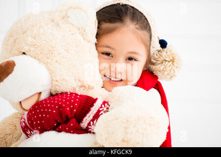 happy little girl holding teddy bear Stock Photo