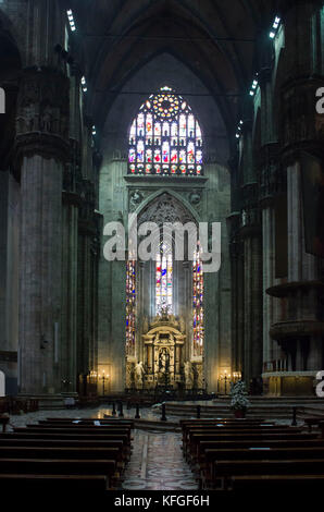 MILAN, ITALY - MAY 11 2014: Duomo Catheral in Milan, interiors of the liturgic area with benches and the altar, no people Stock Photo