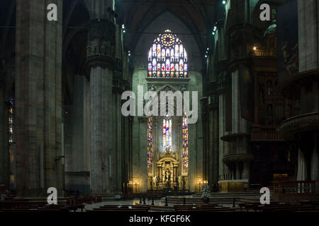 MILAN, ITALY - MAY 11 2014: Duomo Catheral in Milan, interiors of the liturgic area with benches and the altar, no people Stock Photo