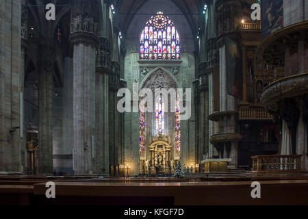 MILAN, ITALY - MAY 11 2014: Duomo Catheral in Milan, interiors of the liturgic area with benches and the altar, no people Stock Photo