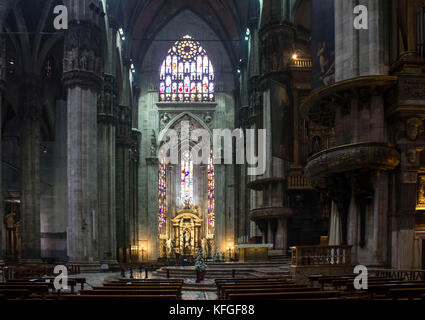 MILAN, ITALY - MAY 11 2014: Duomo Catheral in Milan, interiors of the liturgic area with benches and the altar, no people Stock Photo