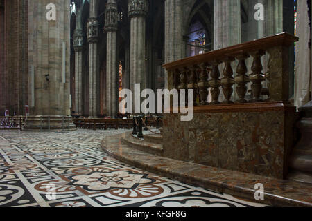 MILAN, ITALY - MAY 11 2014: Inside Duomo cathedral in Milan, detail of the decorated floor in candoglia marble with flower pattern Stock Photo