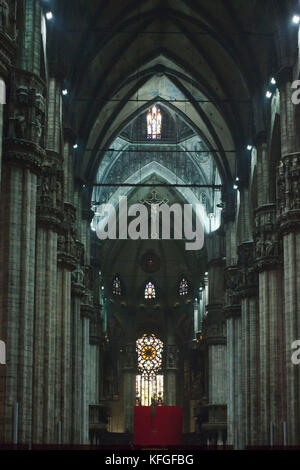 MILAN, ITALY - MAY 11 2014: Central Aisle of Milan Duomo Cathedral, with its crucifix and giants columns Stock Photo