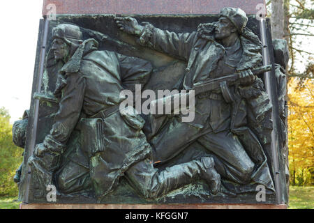 Battle of Sokolovo depicted in the bas relief on the base of the Monument to Otakar Jaroš by Czech sculptor Oskar Kozák (1958) in Mělník in Central Bohemia, Czech Republic. The Battle of Sokolovo took place in March 1943 next to okolovo near Kharkiv (now in Ukraine), when the on-going attack of the Wehrmacht was delayed by joint Soviet and Czechoslovak forces. Czech military officer Otakar Jaroš was killed in the Battle of Sokolovo and became the first member of a foreign army decorated with the Gold Star of the Hero of the Soviet Union, which was the highest decoration in the USSR. Stock Photo