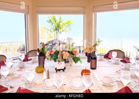 Beautiful restaurant event table setting in front of bright window Stock Photo