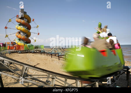 Small rollercoaster, helter-skelter and big wheel, Cleethorpes, North East Lincolnshire, UK. Stock Photo