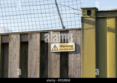 Warning anti climb pain sign at Rainham Marshes RSPB Reserve Stock Photo