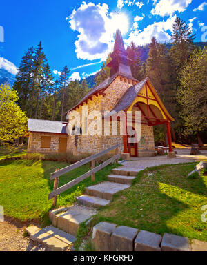 Church and Braies lake in Dolomite Apls, South Tyrol, Italy Stock Photo