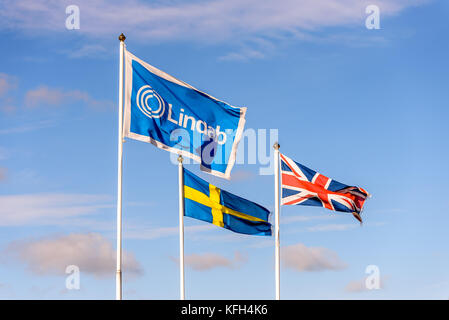 Northampton, UK - Oct 25, 2017: Day view of Lindab logo on flag at Riverside Retail Park. Stock Photo