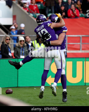 Minnesota Vikings' Adam Thielen (left) celebrates scoring his