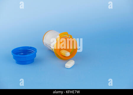 Photograph of two prescription pills from a bottle of Amoxik, generic antibiotic for Augmentin. 875 MG TAB. USA. Stock Photo