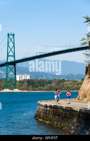 Stanley Park Seawall and Lions Gate Bridge, Vancouver, British Columbia, Canada Stock Photo