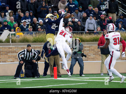 South Bend, Indiana, USA. 28th Oct, 2017. Notre Dame wide receiver Kevin Stepherson (29) and North Carolina State defensive back Nick McCloud (21) battle for the ball during NCAA football game action between the North Carolina State Wolfpack and the Notre Dame Fighting Irish at Notre Dame Stadium in South Bend, Indiana. Notre Dame defeated North Carolina State 35-14. John Mersits/CSM/Alamy Live News Stock Photo