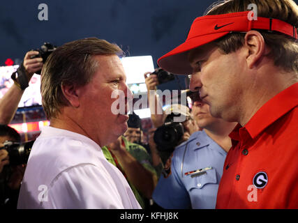 Jacksonville, Florida, USA. 28th Oct, 2017. MONICA HERNDON | Times.Florida Gators head coach Jim McElwain greets Georgia Bulldogs head coach Kirby Smart after the game at EverBank Field, in Jacksonville, Fla. on October 28, 2017. The Georgia Bulldogs won 42-7. Credit: Monica Herndon/Tampa Bay Times/ZUMA Wire/Alamy Live News Stock Photo