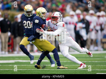 South Bend, Indiana, USA. 28th Oct, 2017. Notre Dame wide receiver Chris Finke (10) is tackled by North Carolina State defensive back Nick McCloud (21) during NCAA football game action between the North Carolina State Wolfpack and the Notre Dame Fighting Irish at Notre Dame Stadium in South Bend, Indiana. Notre Dame defeated North Carolina State 35-14. John Mersits/CSM/Alamy Live News Stock Photo