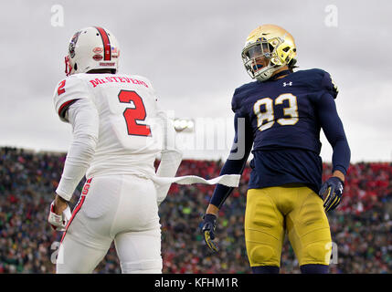 South Bend, Indiana, USA. 28th Oct, 2017. Notre Dame wide receiver Chase Claypool (83) and North Carolina State defensive back Mike Stevens (2) during NCAA football game action between the North Carolina State Wolfpack and the Notre Dame Fighting Irish at Notre Dame Stadium in South Bend, Indiana. Notre Dame defeated North Carolina State 35-14. John Mersits/CSM/Alamy Live News Stock Photo