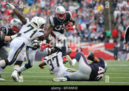 Foxborough, Massachusetts, USA. 29th Oct, 2017. October 29, 2017: New England Patriots running back Mike Gillislee (35) leaps over a pile during a rushing play in the game between the Los Angeles Chargers and New England Patriots, Gillette Stadium, Foxborough, Peter Joneleit Stock Photo