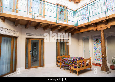 BUKHARA, UZBEKISTAN - OCTOBER 19, 2016: Interior of the hotel in Bukhara. Inner courtyard decorated in national style Stock Photo