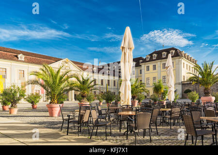 LUDWIGSBURG, GERMANY - OCTOBER 25, 2017: Chairs and tables of the castle cafe invite to take a rest and enjoy the warm afternoon sun Stock Photo