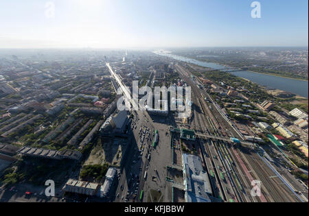 Aerial city view with crossroads, roads, houses, buildings, parks, parking lots Stock Photo