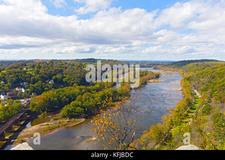 Aerial view on a trail along Potomac River and buildings near Harpers Ferry railway station. Panoramic view on Harpers Ferry National Historic Park in Stock Photo