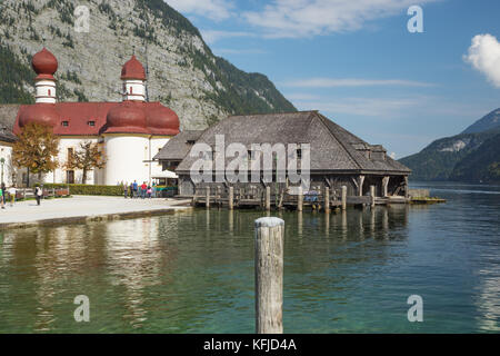 Editorial: BERCHTESGADEN, GERMANY, September 25, 2017 - On the jetty at the Hirschau peninsula with St. Bartholomew's Church in the background Stock Photo