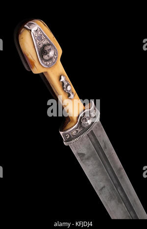 Part of beautiful example of caucasian dagger with ornament grip and blade from Damascus steel. (1907). Dag(h)estani master who worked in Tiflis (mode Stock Photo