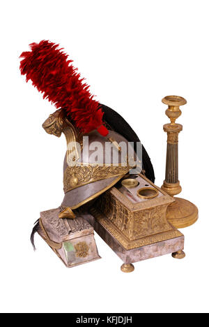 Composition with French cuirassier helmet (1836), bronze inkstand with gilding (1830) and old bronze candlestick (candleholder). Path on white backgro Stock Photo