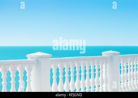 Summer view with classic white balustrade and empty terrace overlooking the sea. Summer background. Tourism Stock Photo