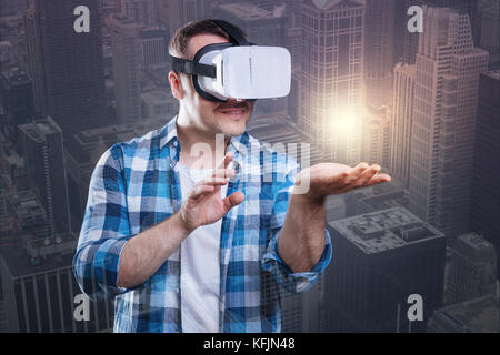 Astonished happy man exploring a virtual world Stock Photo