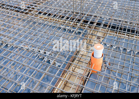 Reinforcement metal framework for concrete pouring. Ready for filling up with concrete - foundation of a new house Stock Photo