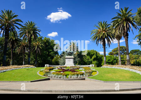 Statue of Edward VII, with floral clock in foreground, in Queen Victoria Gardens within the King's Domain Park in Melbourne, Victoria, Australia Stock Photo