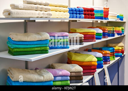 Colored terry towels on store shelves Stock Photo