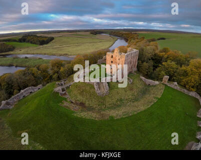 Aerial view of the Scottish Border with Norham Castle standing guard on the English side of the border on the River Tweed Stock Photo