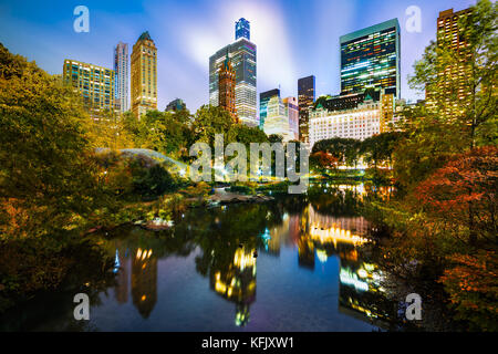 The Pond by night, as viewed from Gapstow Bridge in Central Park, New York City Stock Photo