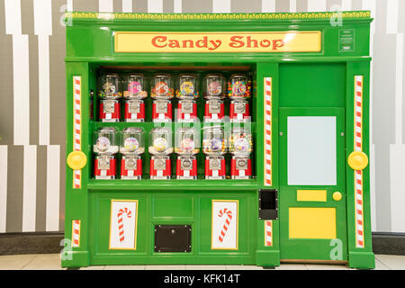 A sweet vending machine in a shopping centre, England, UK Stock Photo