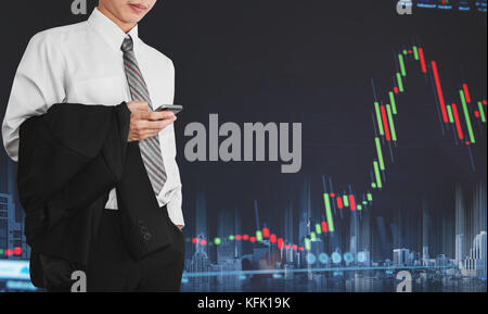 Businessman using mobile smart phone with increasing graph. Development and growth in stock market and business investment Stock Photo