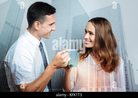 Joyful positive colleagues having tea Stock Photo
