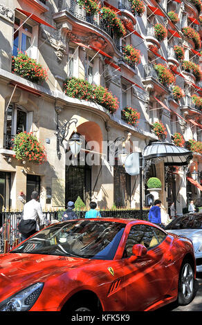 Plaza Athenée palace hotel and Ferrari car, Montaigne avenue, Paris, France Stock Photo